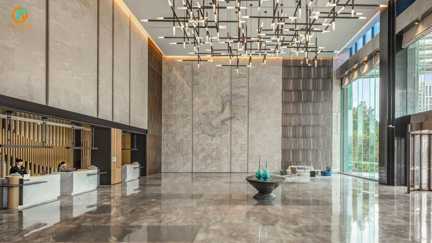 Supplier reference: contemporary hotel reception with tall stone walls and linear sculptural lighting